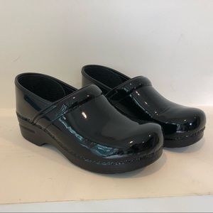 Dansko patent leather clogs